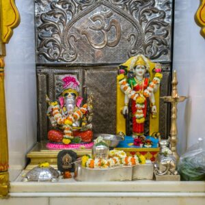 Beautiful idols of Lord Ganesha and Devi Parvati being worshipped at a Hindu Temple