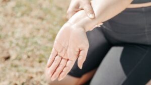 Close-Up Photo of a Woman Stretching Her Wrist