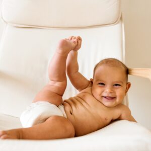 Funny cute baby doing yoga fitness