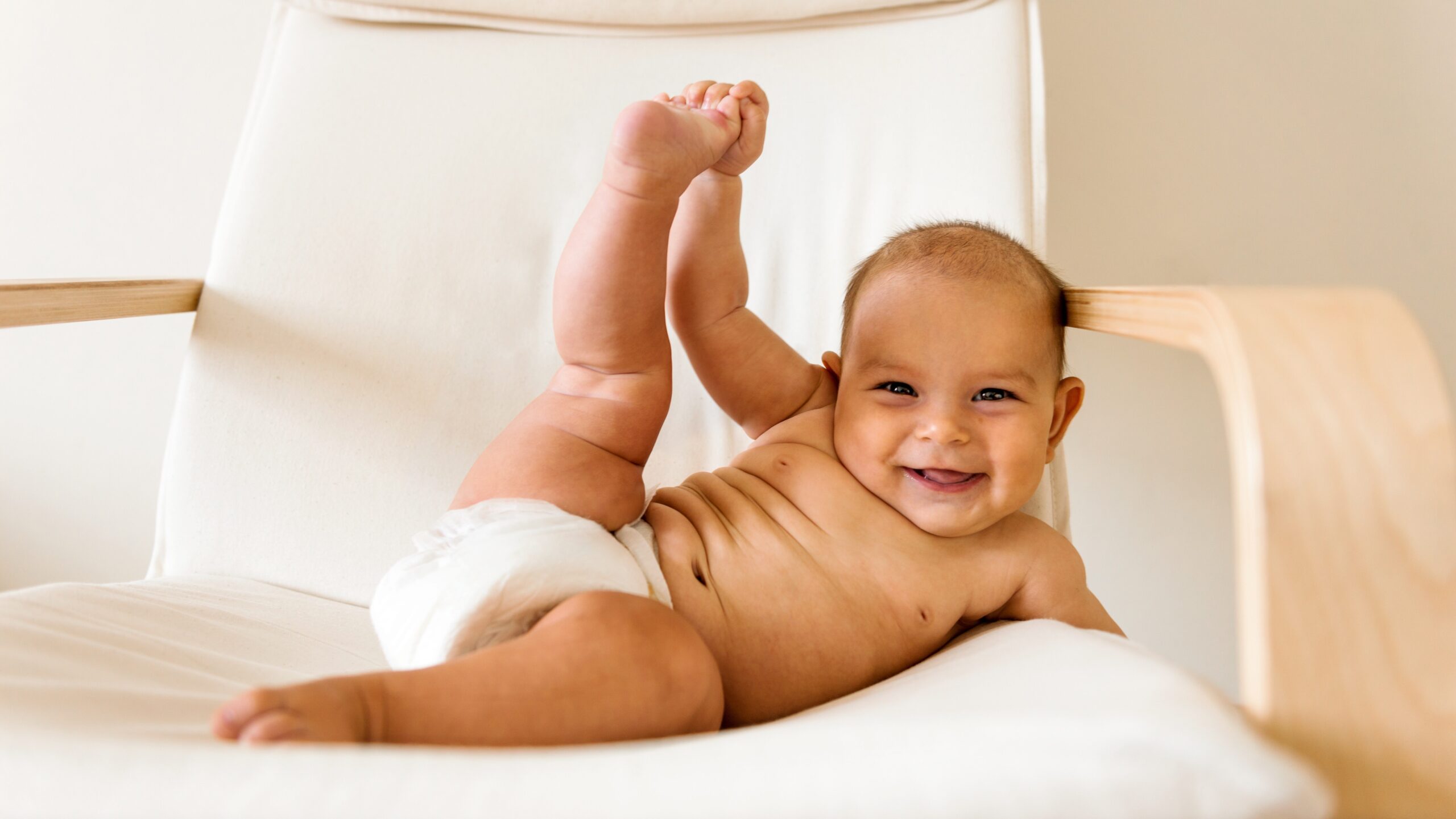 Funny cute baby doing yoga fitness