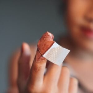Girl first aid finger injury by herself